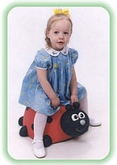 Young girl with riding toy