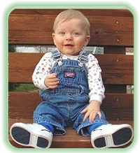 Young boy sitting on bench