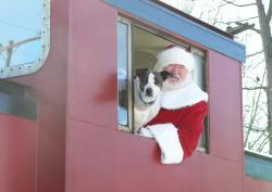 Santa in caboose of Toys for Tots train