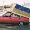 4 photos of vastly overloaded car