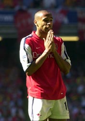 Arsenal player praying
before a soccer match